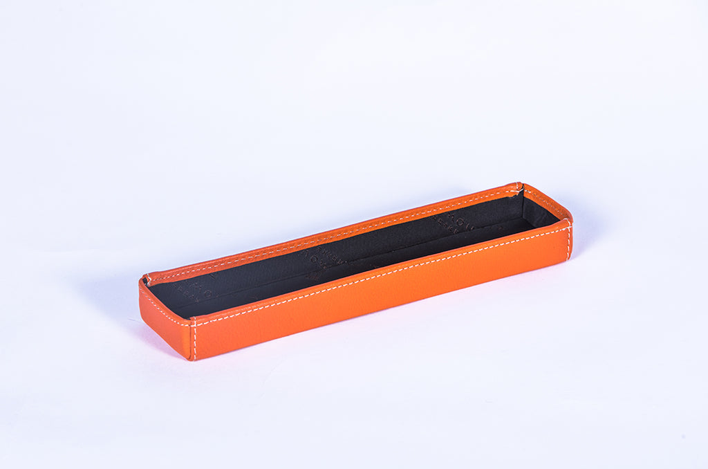 Orange leather support for TV remote control